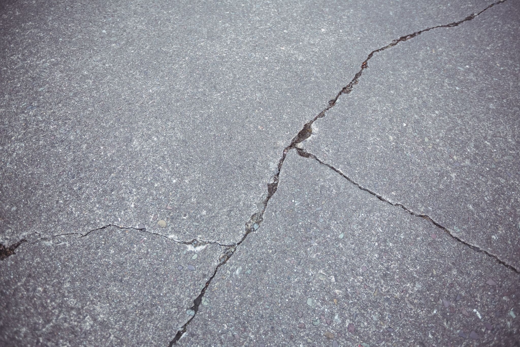 Close-up of cracked concrete surface